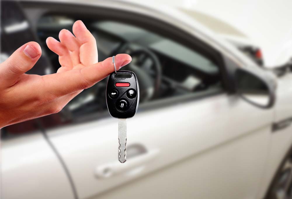 Customer's hand with a car key